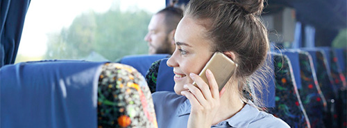 Lady on a bus looking out of the window